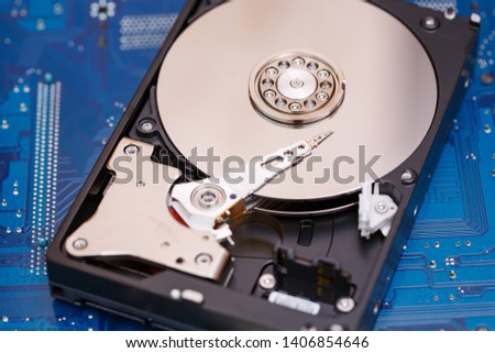 Components for PC. Open hard disk storage. Recovery and storage of information. Magnetic disks inside HDD. Modern digital technology.