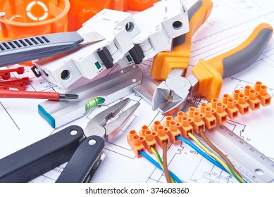Components for use in electrical installations. Cut pliers, connectors, fuses, knife and wires. Accessories for engineering work, energy concept.
