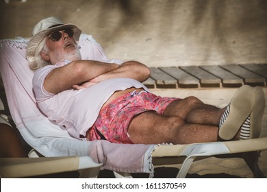 Comporta, Portugal- 21.September 2019: Old man is relaxing on the beach