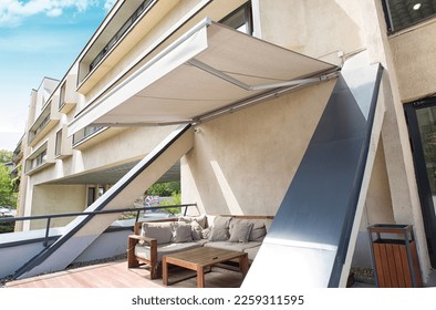 comportable teracce with awning and sofa