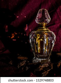 Composed A Shot Of An Oud Attar Bottle I Had By Using My Tshirt , Oud Wood Chips And A Mobile Flash. 