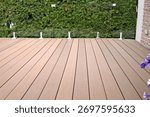 Composite deck with glass panel railing as a durable solution.
