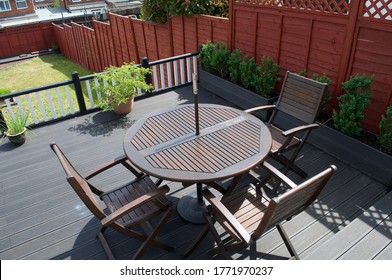 Composite Deck with part restored furniture set and composite planters for box hedging. - Shutterstock ID 1771970237