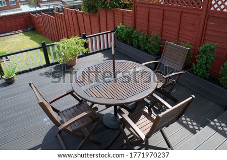 Composite Deck with part restored furniture set and composite planters for box hedging.