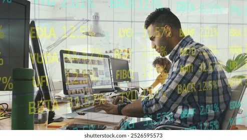 Composite of financial data processing over businessman using computer in office. Global business, finance, data processing and computing concept digitally generated image. - Powered by Shutterstock