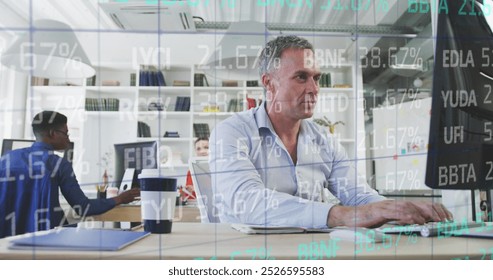 Composite of financial data processing over businessman using computer in office. Global business, finance, data processing and computing concept digitally generated image. - Powered by Shutterstock - Get 15% off with code: PIKWIZARD15