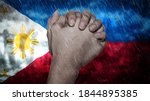 Composite of a hand praying, the Flag of Philippines and rain clouds. Symbolizing heavy rains, storms, typhoons and other bad weather in the country. 3d illustration