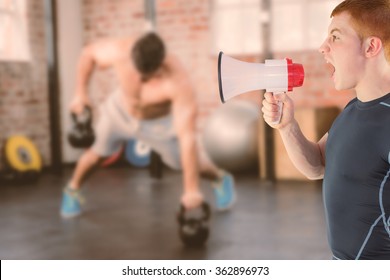 Composite Image Of Angry Rugby Player Yelling Through The Megaphone