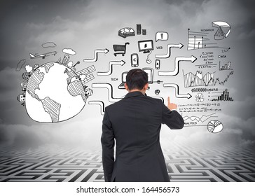 Composite image of Asian businessman pointing