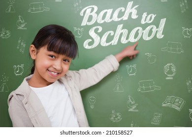 Composite image of back to school message against cute pupil pointing