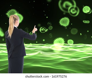 Composite image of blonde businesswoman pointing somewhere - Powered by Shutterstock