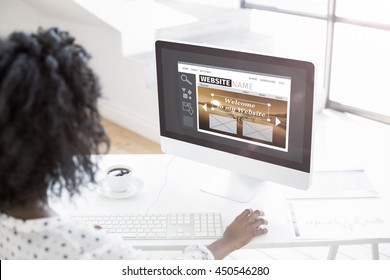 Composite Image Of Build Website Interface Against Over The Shoulder View Of Woman Using Computer