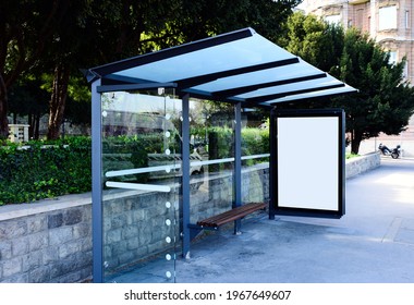 Composite Image Of Bus Shelter And White Lightbox. Transit Stop. Blank. Glass Structure. Urban Setting. City Street Background. Asphalt Sidewalk.blank Poster Ad Commercial Space. Background For Mockup