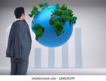 Composite image of businessman standing