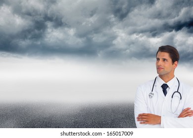 Composite Image Of Confident Doctor With Arms Crossed Looking Up