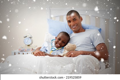 Composite Image Of Father With His Sick Child Against Snow Falling