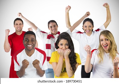 Composite image of football fans against white background with vignette - Powered by Shutterstock