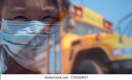 Composite Image Of Girl With Concerned Look In Eyes Wearing Blue Face Mask For Protection During Pandemic In Front Of Yellow Public School Bus