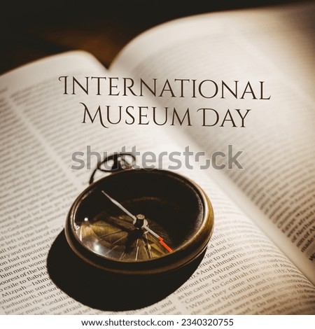 Composite image of international museum day text with navigational compass on book. education, direction, history, awareness and exhibition concept.