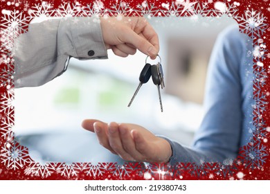 Composite Image Of Man Giving Keys To Someone Against Snow