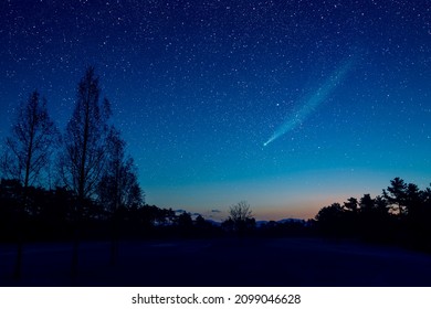 Composite image of starry sky and comet