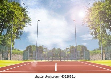 Composite image of tennis field on a sunny day