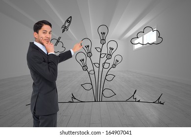Composite image of thoughtful asian businessman pointing - Shutterstock ID 164907041