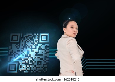 Composite image of unsmiling asian businesswoman pointing