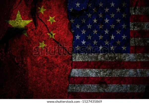 Composite image of US flag and\
China flag on the cracked rocky wall as a trade conflict\
concept