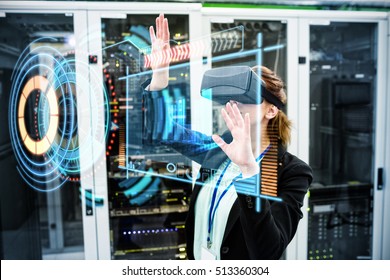 Composite image of volume knob with graphs against technician wearing virtual reality headset while standing - Powered by Shutterstock