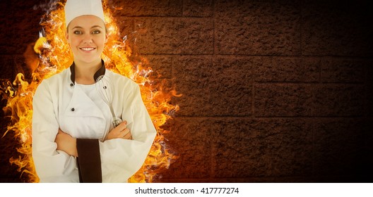 Composite Image Of Woman Chef Smiling And Crossed Arms On Fire And Stone Background