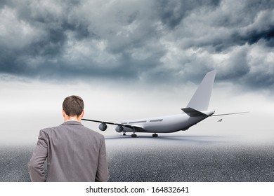 Composite Image Of Young Businessman Walking Away From Camera