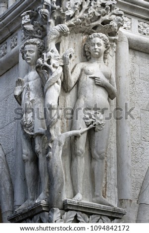 Composition of Adam and Eva on the facade of the Doge's Palace in Venice, Italy