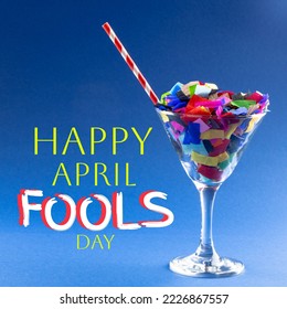 Composition of april fools day text over cocktail glass with confetti and straw. April fools day and joking concept digitally generated image. - Powered by Shutterstock