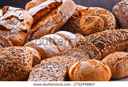 Composition with assorted bakery products including loafs of bread and rolls