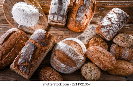 Composition With Assorted Bakery Products On Wooden Table.