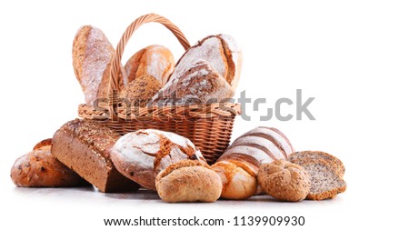 Composition with assorted bakery products in wicker basket isolated on white
