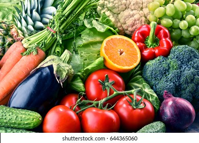 Composition with assorted raw organic vegetables and fruits. Detox diet - Shutterstock ID 644365060