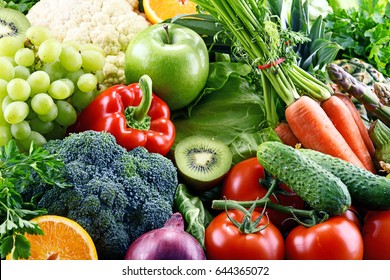 Composition with assorted raw organic vegetables and fruits. Detox diet - Shutterstock ID 644365072