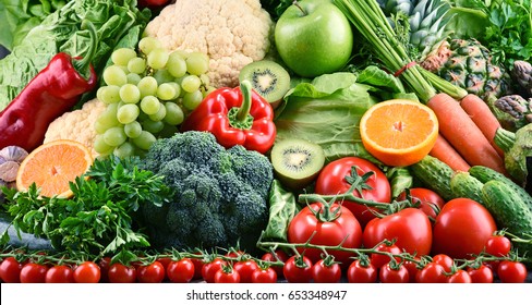 Composition with assorted raw organic vegetables and fruits. Detox diet - Shutterstock ID 653348947