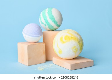 Composition with bath bombs on blue background