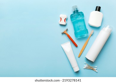 Composition with bath cosmetics on table. razor, toothpaste, soap, gel, toothbrush, mouthwash and other various accessories. Cosmetics for skin health. Bath Mockup for your logo.