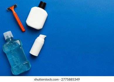 Composition with bath cosmetics on table. razor, toothpaste, soap, gel, toothbrush, mouthwash and other various accessories. Cosmetics for skin health. Bath Mockup for your logo.