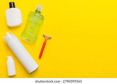Composition with bath cosmetics on table. razor, toothpaste, soap, gel, toothbrush, mouthwash and other various accessories. Cosmetics for skin health. Bath Mockup for your logo.