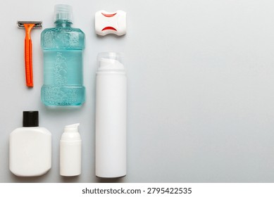 Composition with bath cosmetics on table. razor, toothpaste, soap, gel, toothbrush, mouthwash and other various accessories. Cosmetics for skin health. Bath Mockup for your logo.