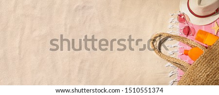Composition with beach accessories and space for text on sand, flat lay. Banner design 