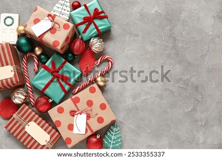 Composition with beautiful Christmas gifts, decorations and cookies on grunge background