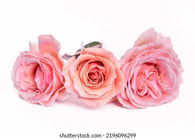 Composition Of Beautiful Flowers On A White Background. Roses, Lilies, Mint Grass, Arrangement Of Flowers, Arrangement Of Pink Flowers On The Table. Pastel Colors. Valentine's Day. Mothers Day. Women'