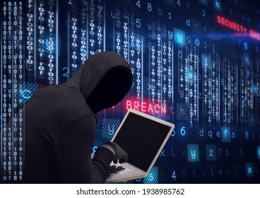 Composition of binary coding and cyber crime warning text over hacker in hood using laptop. online security cyber attack concept digitally generated image.