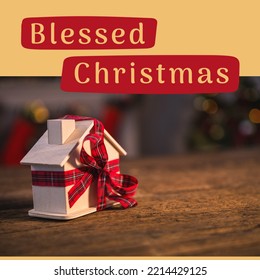 Composition Of Blessed Christmas Text Over Toy House. Christmas, Tradition And Celebration Concept Digitally Generated Image.